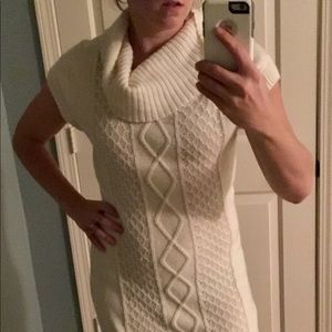 Knitted cream colored vowel neck sweater dress